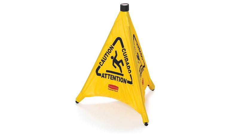 Collapsible sign automatically deploys when removed from wall-mounted storage tube. Multilingual safety communication utilizes ANSI/OSHA-compliant colour and graphics