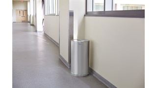 The Metallic Series 15 Gallon FGCC16 Indoor Waste Container has a sleek design that blends nicely with upscale interiors.