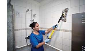 HYGEN™ Microfibre Flexi-Frame Scrubbing Cover has vertical scrubber stripes to help remove stubborn spots and clean into grout lines.